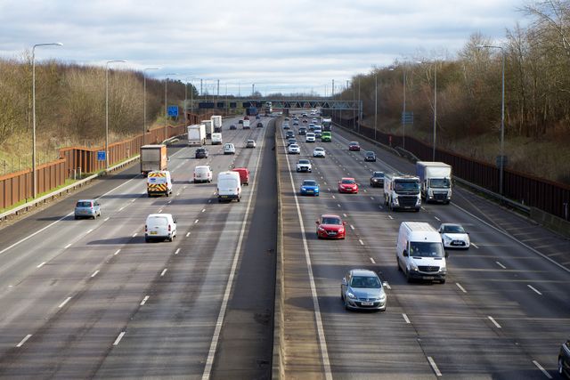 Vans and lorries travelling on a busy English motorway